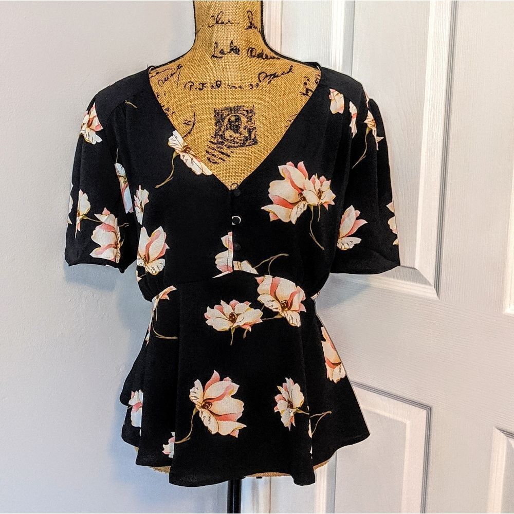 Black and floral peplum blouse